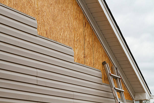 Professional Storm Damage Siding Repair technician working in Bridgeport, NY